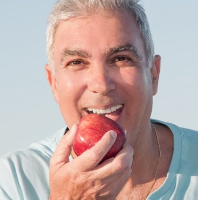 happy patient about to enjoy the benefits of All-On-4 implants in Garland