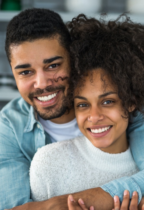 Man and woman with attractive smiles after cosmetic dentistry