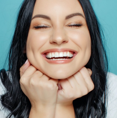 Woman sharing bright smile after teeth whitening