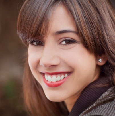 Woman with flawless smile after gum recontouring
