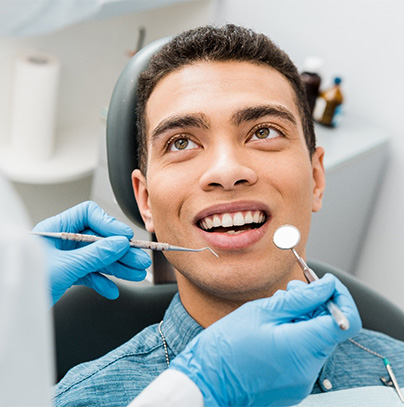 a person having their teeth examined