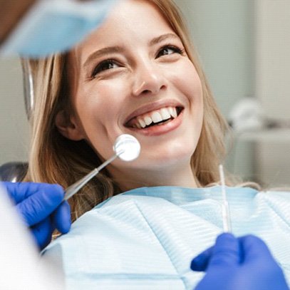 Lady smiles at dentist