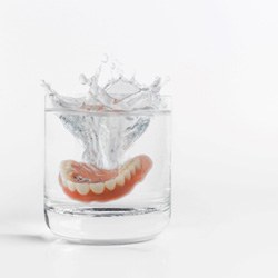 Dentures in a glass of water   