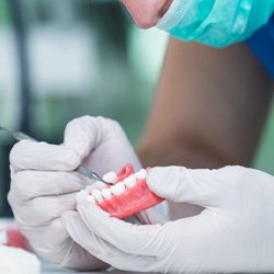 Lab technician creating new dentures    