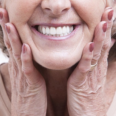 woman smiling with dentures in Garland