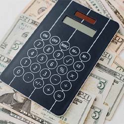 Calculator and cash on table