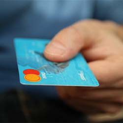 Man holding credit card for payment