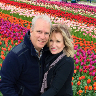 Dr. Peterson with his wife in a field of flowers