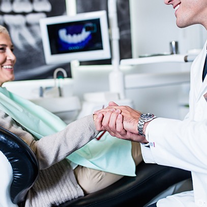 Dentist explaining how dental implants in North Garland work