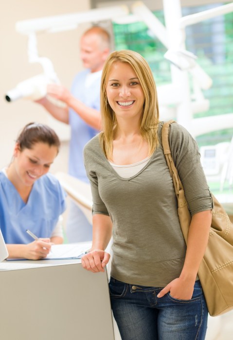 Woman in dental office smiling