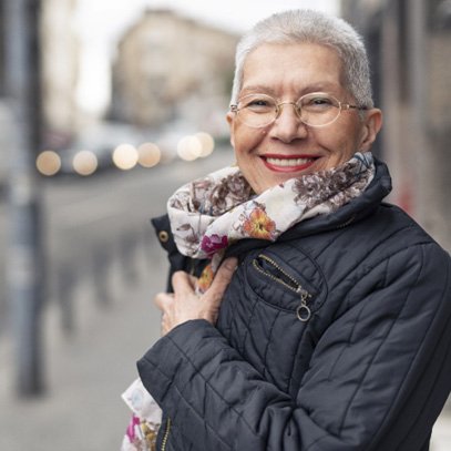 Woman smiling with dental implants in Garland