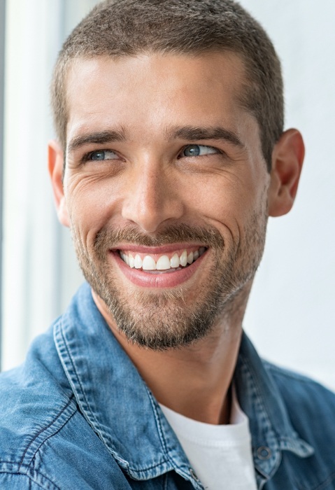 Man with  healthy smile after gum disease treatment