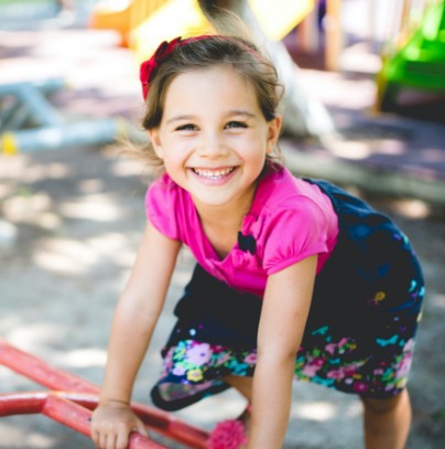 Young girl smiling during children's dentistry visit