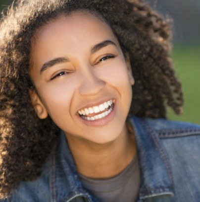 Young girl with dental sealants smiling