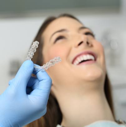 Dentist fitting patient with a nightguard for teeth grinding