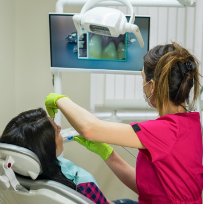 Dentist using intraoral cameras to capture images