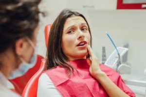 Concerned patient and dentist discussing treatment options