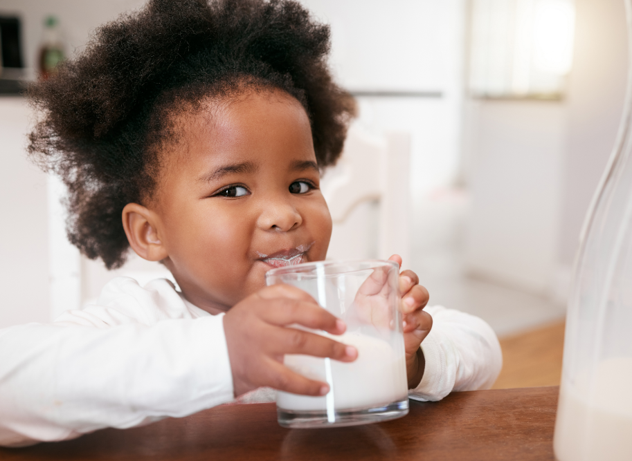 Little girl drinking milk