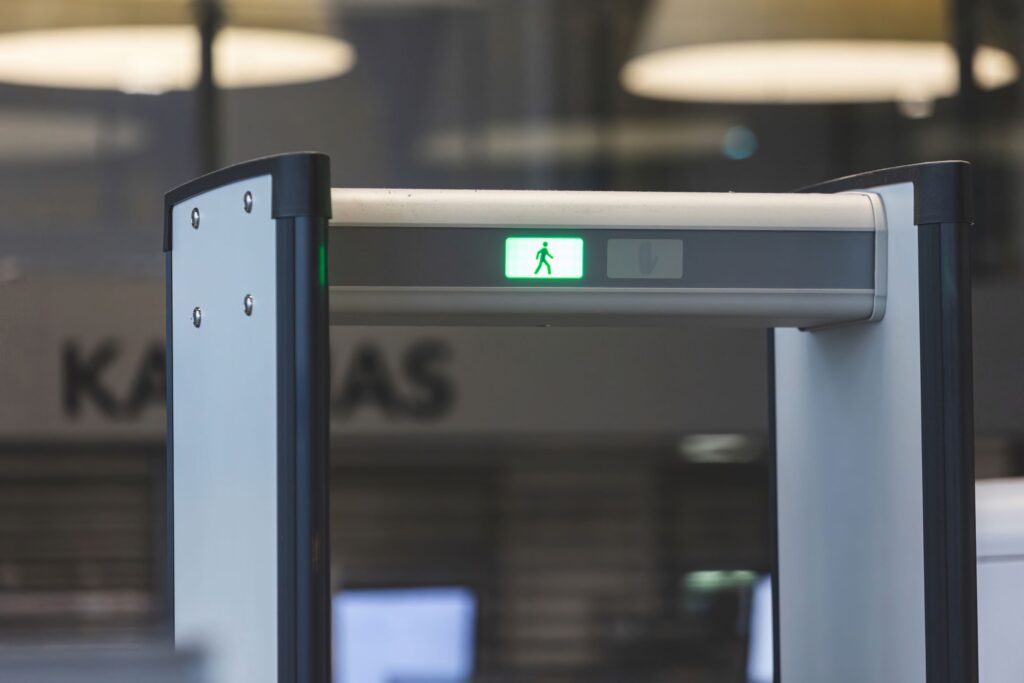 Metal detector with green light at airport